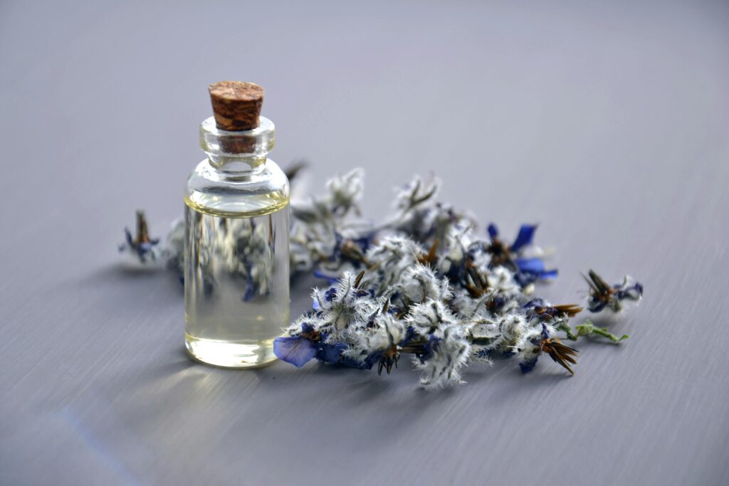 pexels-photo-932577-932577 Close-up of a lavender oil bottle with dried flowers for aromatherapy. Perfect for wellness themes.